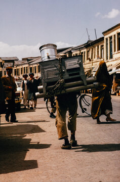 Anonymous Porter Carrying Oven on His Back