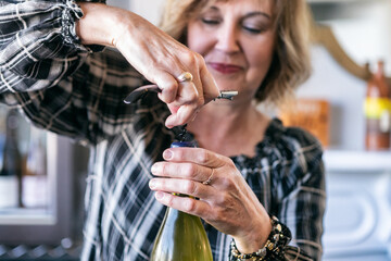 Hostess Uses Corkscrew To Open Wine