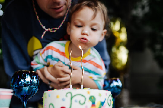 Blowing the candles on birthday cake