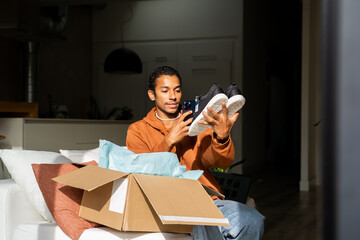 Man opening delivery box from second hand shop