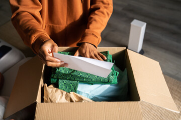 Man opening delivery box from second hand shop