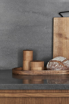 Craft bread on tray with wooden storage containers