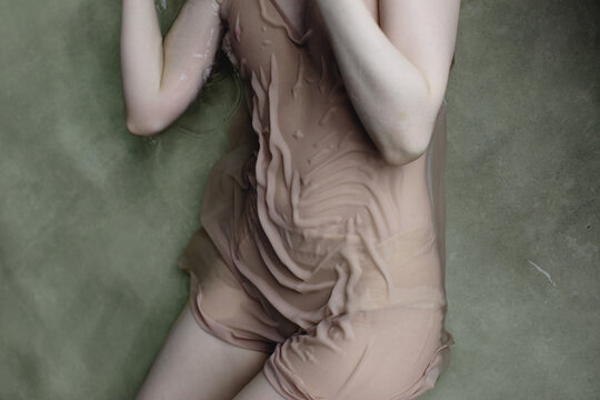 Woman lying in water