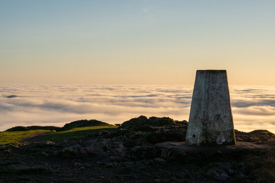 A trig point on top of a hill
