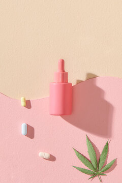 Cosmetic glass bottles with a pipette and CBD oil, THC tincture