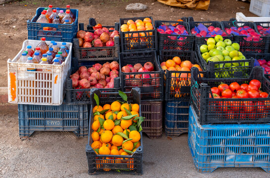 local market: plastic boxes with drinks and fruits