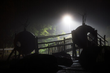 An adventure playground silhouetted at night
