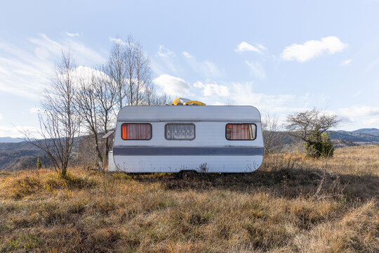 One isolated camper van in the field.