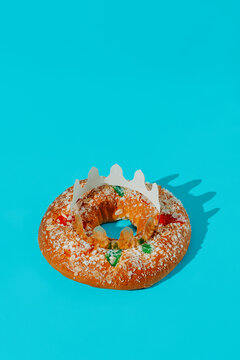 a spanish king cake on a blue background
