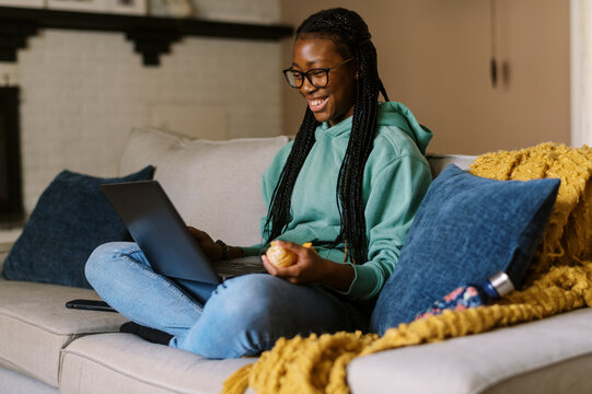 Smiling Teenage Girl At Home On Laptop