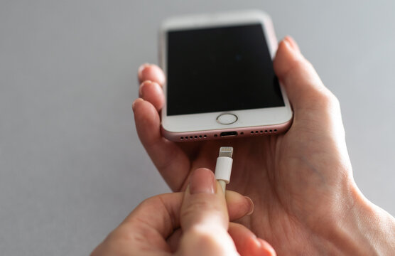 Kiev, Ukraine - December 10, 2022: Close-up iPhone charging.