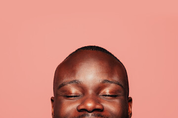 Serious black man looking at camera