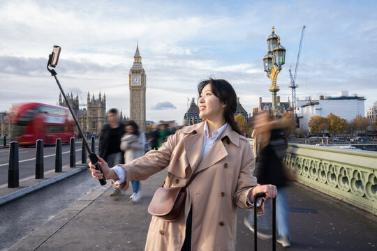 Woman Using Selfie Stick In London