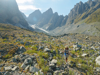Woman hikes in an alpine mountain area