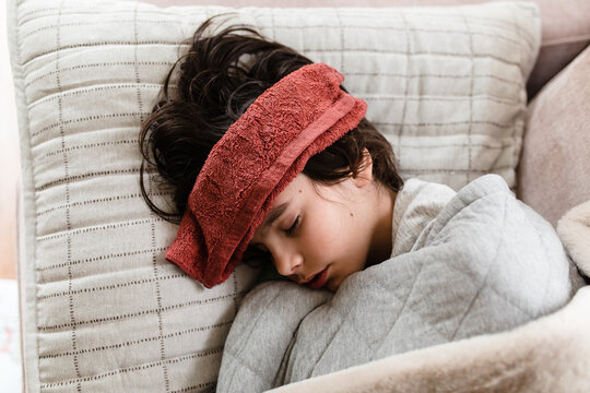 Overhead view of sick boy sleeping