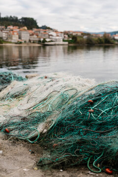 Fishing nets on shore in town
