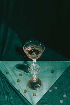 A glass of wine standing on a mirror