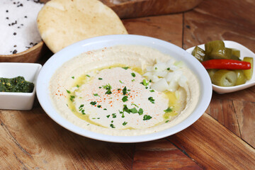 Hummus is a cream of chickpeas cooked with lemon juice, which includes tahini paste and olive oil, which, depending on the local variant, can also include other ingredients such as garlic or paprika.