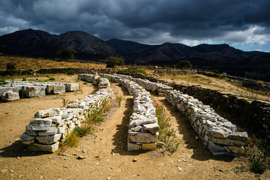 Rows of old stone stacked in a field.