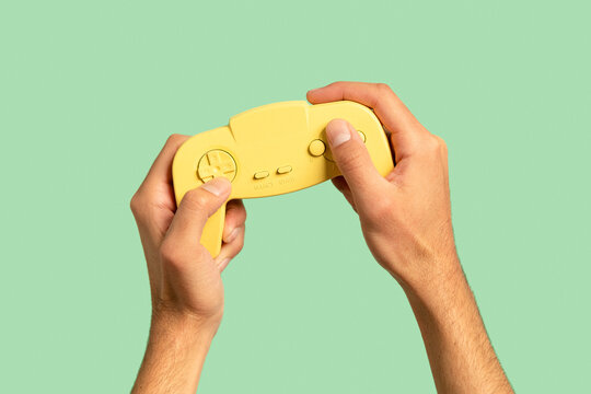 Hands holding gaming gamepad controller 