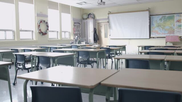 Classroom education - desks in an empty school room