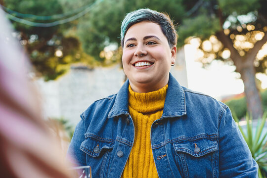 Confident and Proud: Non-binary Curvy Woman in a Outdoor Bar