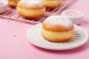 Donuts Doughnuts with Icing Sugar and Sprinkles on Pink Background