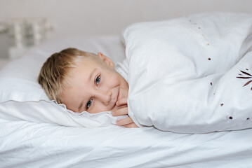 boy in white bed