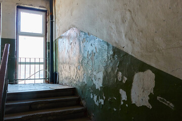 An old ruined stairwell in an office or industrial building