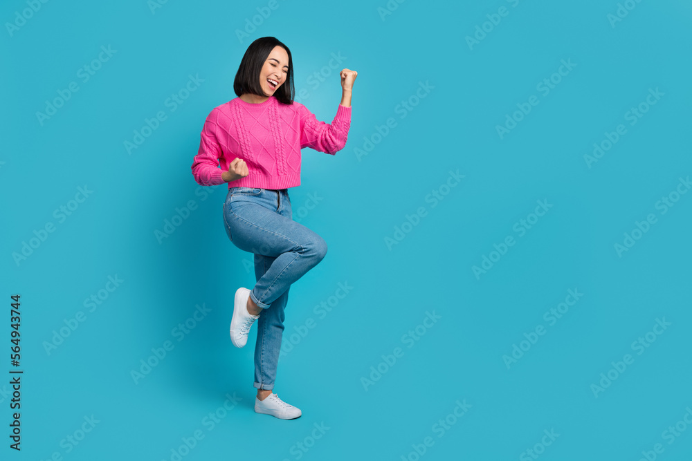 Sticker full size portrait of overjoyed glad girl raise fists luck success empty space isolated on blue colo