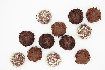 Several chocolates on white background