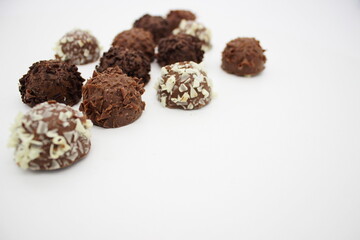 Several chocolates on white background