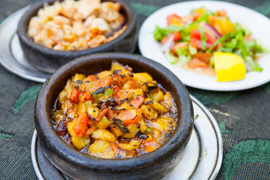 A typical Turkish dish with a hot pot potatoes and salad.