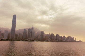 Hong Kong city skyline at sunset, vintage style