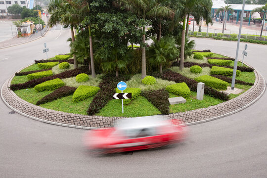 Taxi going round a roundabout in Hong Kong, China.