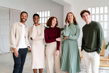 Diverse Cheerful Employees In Spacious Office