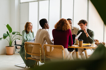 Diverse People Working Together In Modern Office