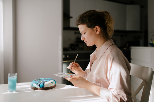 Woman Decorating Cake