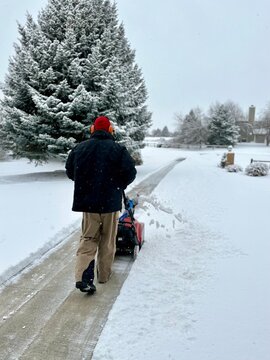 Snow blowing the driveway 