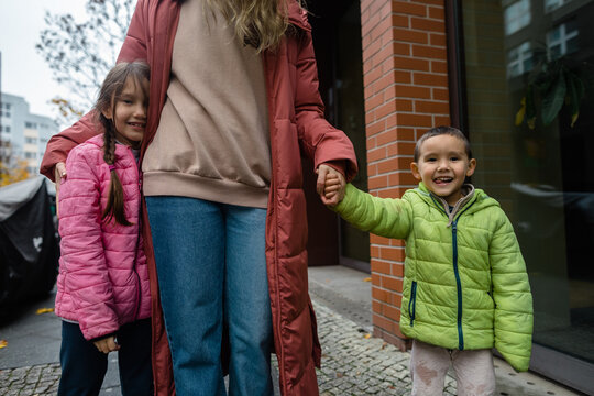 Children and mother on street