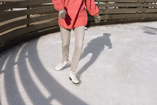 Woman skating on ice rink
