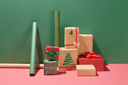 Christmas background with gift boxes, paper's rools and decorations