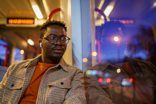 Man with Earphones while commuting home
