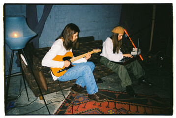 Musician partner practicing in music studio
