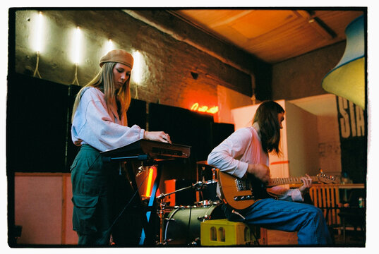Musician partner practicing in music studio
