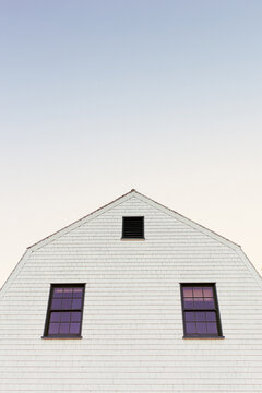 White Clapboard Coastal Home with Gambrel Roof
