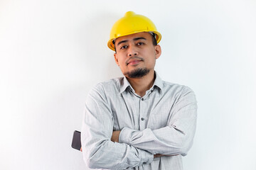 Asian manager civil engineer in uniform hard hat holding clipboard working in studio isolated white background.
