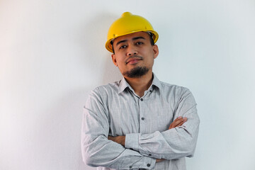 Asian manager civil engineer in uniform hard hat holding clipboard working in studio isolated white background.
