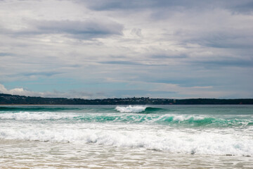 breaking wave at pambula beach