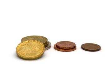 Three stacks of euro coins on a white background.